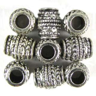 You are buying 18 silver plated pewter barrel beads. They measure 