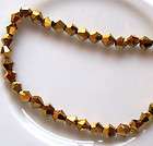 100 5301 bicone Swarovski crystal beads 3mm golden shadow  