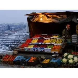  A Palestinian Fruit and Vegetable Vendor Waits for 