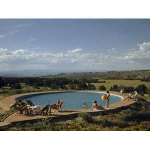  Vacationers Relax Beside Pool Overlooking Plain and 