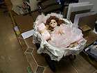 Gorgeous Porcelain musical baby doll with carriage items in 