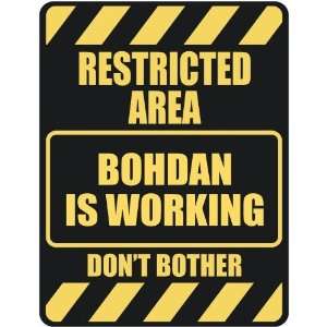   RESTRICTED AREA BOHDAN IS WORKING  PARKING SIGN