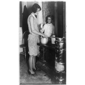  Woman and boy by cookstove 1929