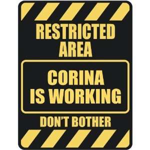   RESTRICTED AREA CORINA IS WORKING  PARKING SIGN