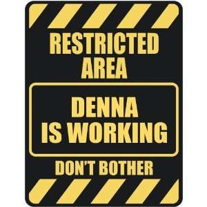   RESTRICTED AREA DENNA IS WORKING  PARKING SIGN