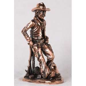   Cowboy Leaning With Gun Holstered Decorative Figurine