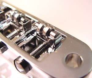 CHROME REPLACEMENT ROLLER GUITAR BRIDGE   small posts  