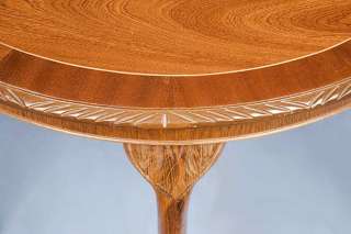Mahogany crossbanding and satinwood string inlay adorn the edges.