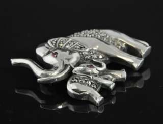   elephant with its baby, both set with natural rubies for eyes