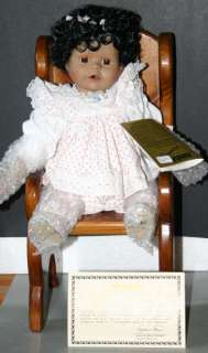 Baby Oprah is a sitting doll and cannot stand up. She is 10 inches 