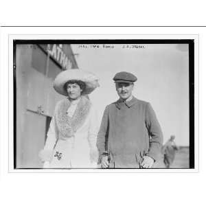   Mrs. Craig Biddle and J.A. Armstrong walking together