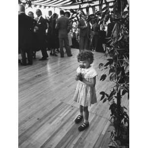  Little Girl Smelling a Flower at John F. Kennedys Wedding 